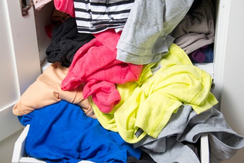 Volunteers and charity partners collecting reusable items from skips